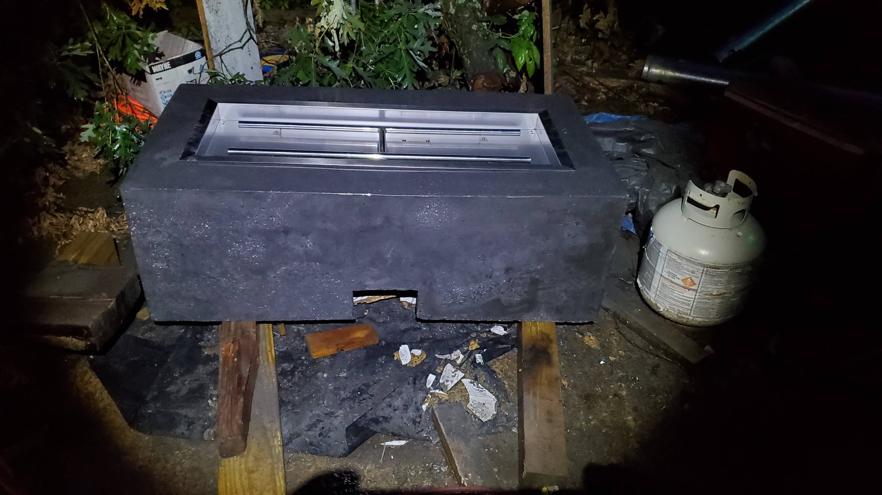 Gas burner insert being fitted into a custom Eleven17 fire table